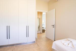 Posteľ alebo postele v izbe v ubytovaní Euphoria Suites