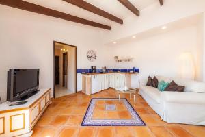 TV a/nebo společenská místnost v ubytování App mit Dachterrasse Panoramablick