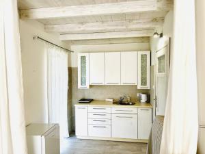 Η κουζίνα ή μικρή κουζίνα στο Pokoje Gościnne AKWARELA +76 φωτογραφίες