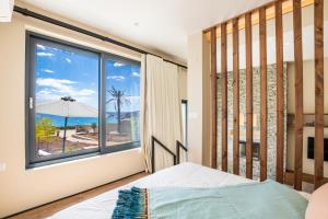 Posteľ alebo postele v izbe v ubytovaní Euphoria Suites