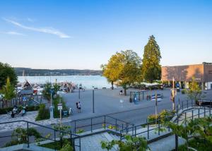 a view of a plaza next to a body of water at Ferienwohnung Maier in Bodman-Ludwigshafen