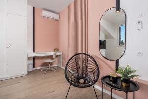 a room with a mirror and a chair and a desk at Apartment Pearl, Opatija center in Opatija +16 photos