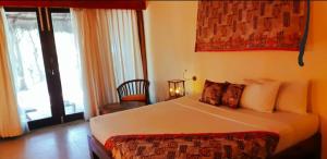 Voodi või voodid majutusasutuse Giman Free Beach Resort toas