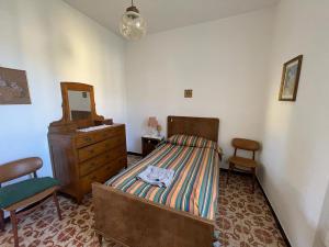 Ένα ή περισσότερα κρεβάτια σε δωμάτιο στο La Casa di Anita