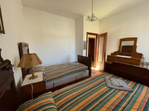 Ένα ή περισσότερα κρεβάτια σε δωμάτιο στο La Casa di Anita