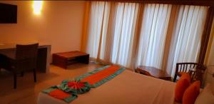 Voodi või voodid majutusasutuse Giman Free Beach Resort toas