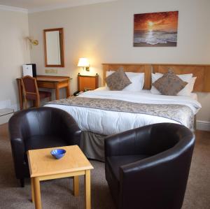A bed or beds in a room at The Sefton 