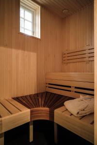 a room with two bunk beds and a window at Engeltofta Sea Lodge in Gävle