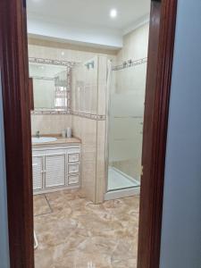 a bathroom with a shower and a sink at Piso Levante in Arcos de la Frontera