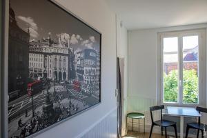 a picture of a picture of a city on the wall at COSY APPARTEMENT - HYPERCENTRE - CALME - 30m2 - ALBI in Albi