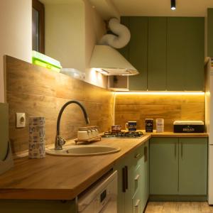 a kitchen with a sink and a counter top at La Casa EmilioAngi in Yerevan