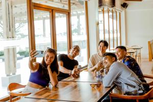 a group of people sitting around a table at Estancia De Lorenzo Tarlac in Tarlac