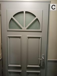 a metal door with a logo on it at Résidence du Temple in Meaux