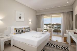 A bed or beds in a room at Sindbad Club