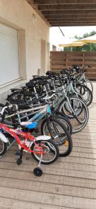 a bunch of bikes parked in a building at La Perle du Littoral in Vias