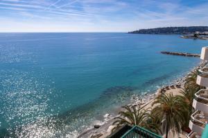 a view of the ocean from a building at Princess Et Richmond in Menton