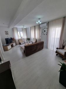 a living room with a couch and a table at Međugorje Apartman Jurković in Donja Mahala
