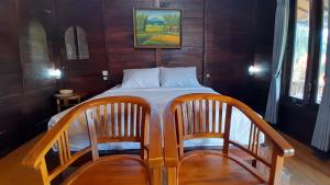Ένα ή περισσότερα κρεβάτια σε δωμάτιο στο The Bocah Desa Village