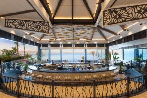 a rendering of a hotel lobby with a bar at Dusit Thani Mactan Cebu Resort in Mactan