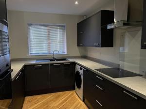 Кухня или мини-кухня в Apartment in Birkdale - 2 bedrooms
