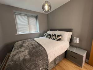 Кровать или кровати в номере Apartment in Birkdale - 2 bedrooms
