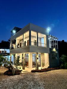 a large house with lights on top of it at Harbour Bliss Hotel in Coron