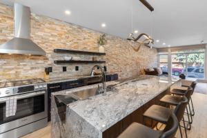 a kitchen with a sink and a counter top at Most Luxurious1Br in town And steps to the Gondola in Telluride