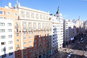 a view of a city street with buildings at Espahotel Gran Vía in Madrid