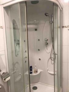 a shower with a glass door in a bathroom at Très beau 2 pièces dans la jolie ville de Bijela - Appart numéro 6 in Bijela