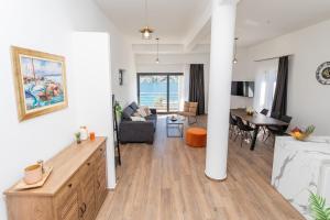 a living room with a couch and a table at Apartments Suzy in Šibenik