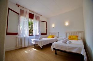 Posteľ alebo postele v izbe v ubytovaní V&V LLORET- Apartamento Europa + 37 fotografií