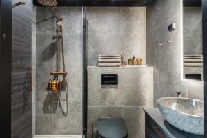 a bathroom with a shower and a sink at Levi OloResort in Levi