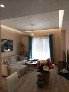 a living room with a couch and a table at Calypso in Athens