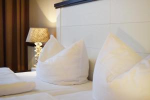 Postel nebo postele na pokoji v ubytování Hotel Strandschlösschen