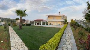 A garden outside Villa with Private S Pool-Theologos by GHH