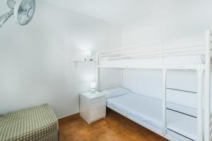 Łóżko lub łóżka w pokoju w obiekcie Dúplex junto a la playa