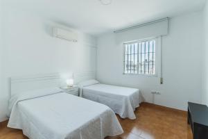 Łóżko lub łóżka w pokoju w obiekcie Dúplex junto a la playa