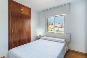 Łóżko lub łóżka w pokoju w obiekcie Dúplex junto a la playa