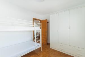 Łóżko lub łóżka w pokoju w obiekcie Dúplex junto a la playa