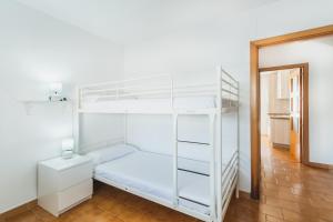 Łóżko lub łóżka w pokoju w obiekcie Dúplex junto a la playa