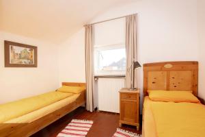 En eller flere senge i et værelse på Lütje Hus