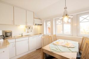 Kuchyň nebo kuchyňský kout v ubytování Uhlenkamp Appartement -7- im UHLENKAMP