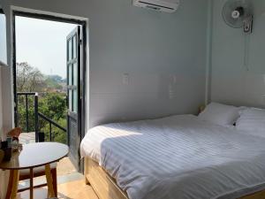 Lova arba lovos apgyvendinimo įstaigoje Phuong Dung Hotel