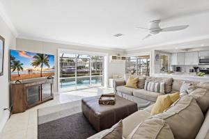 a living room with a couch and a table at 152 Leeward Court in Marco Island