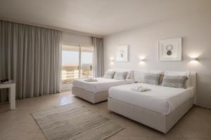A bed or beds in a room at Sindbad Club