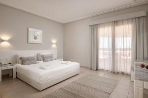A bed or beds in a room at Sindbad Club