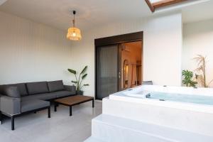 A seating area at Isla Luxury Apartments - Private Hot tub - 100m from beach