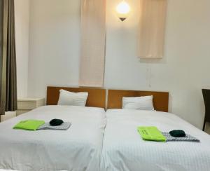 Letto o letti in una camera di JAS HOTEL TAKAYAMA