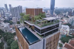 an overhead view of a building with a swimming pool at Romantic Log Cabin 2 - Heart of KL, near KLCC/KL Tower in Kuala Lumpur