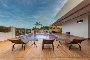 a swimming pool on the roof of a house at TRYP by Wyndham Manaus in Manaus